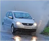  ?? ?? A car splashes through water in Kent