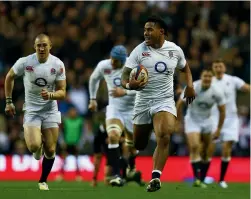  ?? GETTY IMAGES ?? Manu Tuilagi sprints to score an intercept try during England’s 38-21 win over the All Blacks in London in 2012.