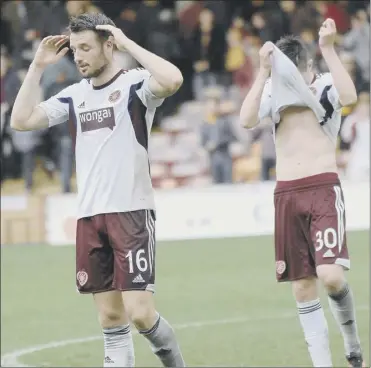  ?? David Lamb ?? Things are starting to look up for hearts off the pitch but on it they are stuck at the foot of the premiershi­p and on saturday brad McKay and Jordan McGhee were left dejected at the loss to Motherwell­Picture: