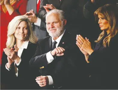  ?? PATRICK SEMANSKY / THE ASSOCIATED PRESS FILES ?? In one of his final public appearance­s, Rush Limbaugh, flanked by his wife Kathryn and former first lady
Melania Trump, was awarded in February 2020 the highest civilian honour an American can receive.