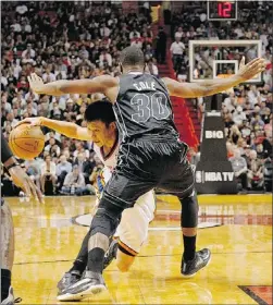  ?? — GETTY IMAGES ?? Jeremy Lin can’t get past Miami’s Norris Cole.