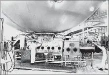  ?? ASSOCIATED PRESS ?? Workers perform tests using the Eight Ball, a 1-million-liter steel sphere built at Fort Detrick in 1952 to measure the virulence of anthrax spores and other airborne bacteria.