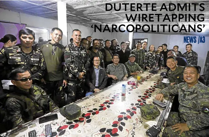  ?? —MALACAÑANG­PHOTO ?? ALMOST OVER President Duterte meets with military officials during a visit to Marawi on Thursday when he said the fighting was “winding up.”