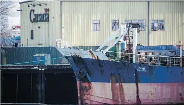  ?? PHOTOS: BEN NELMS FOR NATIONAL POST ?? The MV Sun Sea, which brought nearly 500 Sri Lankan Tamil migrants to the West Coast in 2010, has sat tied to a federal dock at the Annacis Island industrial park in Delta, B.C., since the summer of 2012, as government bureaucrat­s try to find a way to dispose of it.