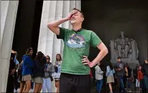  ?? MICHAEL S. WILLIAMSON/WASHINGTON POST ?? At the Lincoln Memorial in Washington, D.C., Mikah Meyer completes a three-year-long quest to visit every National Park Service site in the United States.