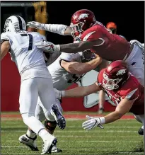  ?? Arkansas Democrat-Gazette/MITCHELL PE MASILUN ?? Arkansas’ defense is the only one in the country which has not allowed an offensive play of 30 or more yards this season. The Razorbacks, however, will be tested in trying to slow down Texas A&M’s offense on Saturday in Arlington, Texas.