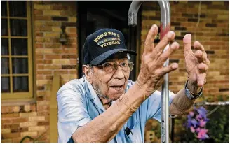  ?? RALPH BARRERA / AMERICAN-STATESMAN ?? Ramon Galindo, 96, has lived off East Riverside Drive overlookin­g downtown Austin for 77 years. He is among the thousands of Latino veterans highlighte­d in the Voces Oral History Project. Galindo is a celebrated magician, and the levitating trick is...