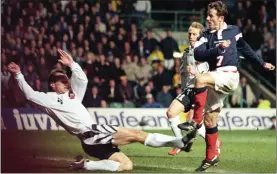  ??  ?? Kevin Gallacher volleys in his second against Austria in 1997