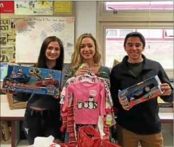  ??  ?? The Garnet Valley High School Peer Counselors Club recently completed its 10th annual present drive, “Gifts from Garnet Valley.” The event benefits City Team Ministries of Chester and the district’s community outreach program, Hearts-to-Homes. Rallying...