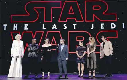  ?? JESSE GRANT/GETTY IMAGES ?? Star Wars: The Last Jedi drummed up excitement at the recent D23 Expo in California with actors Gwendoline Christie, left, John Boyega, Daisy Ridley, director Rian Johnson, and actors Kelly Marie Tran, Laura Dern and Benicio Del Toro on hand for a...