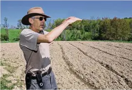  ?? Hans Pennink/Associated Press ?? Seth Jacobs talks about the 500 pounds of marijuana he grew on his Slack Hollow farm in Argyle, N.Y. Farmers growing New York’s first legal adult marijuana crop are having trouble moving product because the state has only a dozen licensed dispensari­es statewide to sell to.