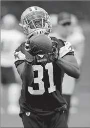  ?? AP FILE PHOTO ?? Dallas Cowboys free safety Byron Jones catches a pass during a June practice in Frisco, Texas. The ex-UConn star expects to have a breakthrou­gh season in his third year with the Cowboys.
