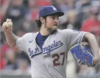  ?? AP PHOTO/BRYNN ANDERSON ?? Los Angeles Dodgers starting pitcher Trevor Bauer (27) delivers in the first inning of a baseball game against the Atlanta Braves on June 6, 2021, in Atlanta.