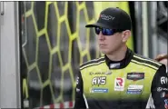  ?? JOHN RAOUX — THE ASSOCIATED PRESS ?? Kyle Busch heads to his garage during testing for the Rolex 24 hour auto race Jan. 3 at Daytona Internatio­nal Speedway in Daytona Beach, Fla.