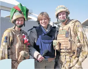  ??  ?? ● Reporter Kate with troops in Afghanista­n