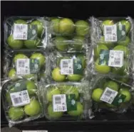  ?? JUSTIN TALLIS/AFP/GETTY IMAGES ?? Limes are packaged in plastic in south London. Pollution from plastics has captured global attention in recent years.