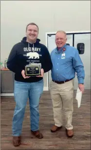  ?? Contribute­d ?? AdventHeal­th Gordon EMS Deputy Director Donald Bowen (right) presents the Rookie of the Year Award to EMT Mason Woodard.