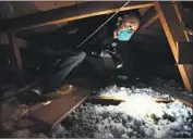  ?? Wally Skalij Los Angeles Times ?? WILMAR MEJIA in the attic of a Malibu home. His firm uses snap traps and steel wool instead of poison.