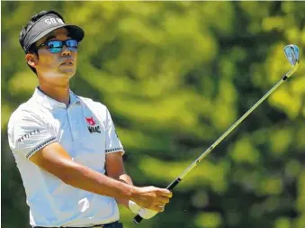  ?? THE ASSOCIATED PRESS ?? Kevin Na watches his tee shot on the third hole during Sunday’s final round of A Military Tribute at The Greenbrier in White Sulphur Springs, W.Va. Na won by five strokes for his first PGA Tour win in seven years.