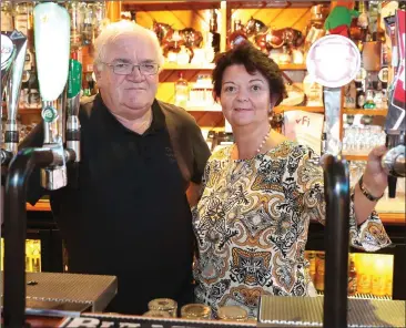  ??  ?? Drogheda’s longest serving barman Henry Gallagher with Colette Nugent in the Market Bar.