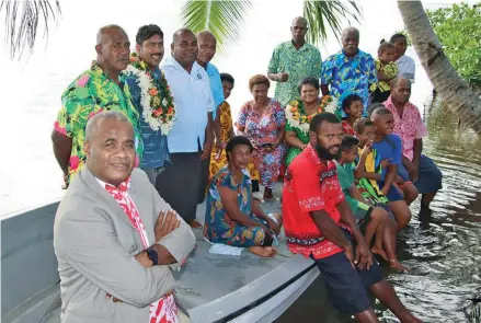  ?? ?? Naivakacau villagers with government officials after the handing over of the new boat and engine last week.