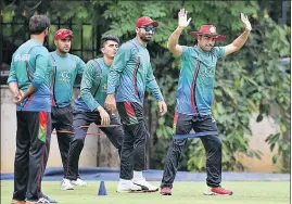  ?? AP ?? Afghanista­n players during a practice session ahead of oneoff Test match against India in Bangalore.