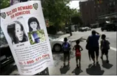  ?? AP Photo ?? This Tuesday, July 23, 2013, photo shows a poster soliciting informatio­n regarding an unidentifi­ed body near the site where the body was found in New York.