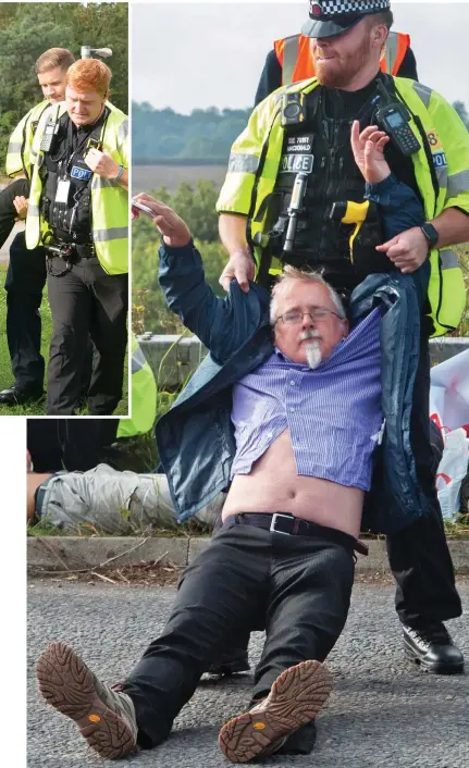  ??  ?? No nonsense: An activist goes limp as an officer hauls him off the road near Stansted airport