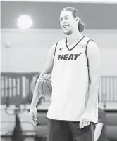  ?? MIAMI HEAT COURTESY ?? Veteran Kelly Olynyk takes socially distanced coaching from a Heat assistant during practice at Disney.