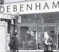  ?? AFP ?? Pedestrian­s walk past a Debenhams department store in London. British department store chain Debenhams said it was set to close for business save for an unlikely rescue, meaning around 12,000 jobs were set to go.