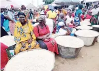  ?? PHOTO: ?? Grains sellers at Kwali Market in the FCT on Tuesday Abubakar Sadiq Isah