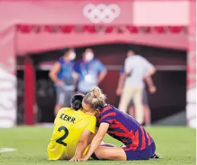  ??  ?? Intimate moment: Kristie Mewis consoles Sam Kerr after Australia’s loss to the US in Tokyo