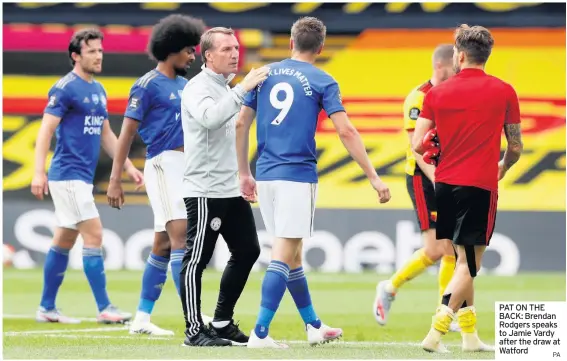  ?? PA ?? PAT ON THE BACK: Brendan Rodgers speaks to Jamie Vardy after the draw at Watford