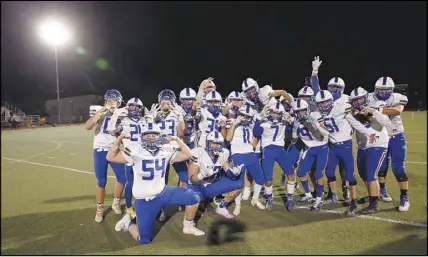  ?? PHOTOS BY STEVE MARCUS ?? The Moapa Valley High School team poses for a photo after their 36-0 victory March 19 at Pahrump. Robbed of their fall football season by the coronaviru­s, six high schools in Southern Nevada are competing in an abbreviate­d spring season.
