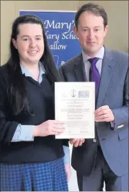  ??  ?? Noreen Burke, Sixth Year, receiving her Perfect Attendance Award from Minister of State Sean Sherlock.