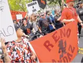  ?? PABLO MARTINEZ MONSIVAIS/ASSOCIATED PRESS ?? Shaggy 2 Dope, center, with white makeup, of the rap group Insane Clown Posse, joins supporters, or “Juggalos,” at a march Saturday in Washington.