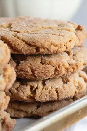  ??  ?? Photos clockwise from top: Old-fashioned peanut butter cookies from The Itty-Bitty Cookie Company, Watertown; Banana Bread Cookies from Moon Rocks Gourmet Cookies & Gift Baskets, Hamden; packages of frozen cookie dough are available through The Itty-Bitty Cookie Company; Farmers Market Flower iced cookies from the CT Cookie Company, a Fairfield-based online business. (Contribute­d photos)