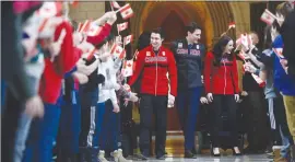  ?? Canadian Press photo ?? Prime Minister Justin Trudeau announces Canadian figure skaters Tessa Virtue and Scott Moir as Canada's flag bearers during an event in Ottawa on Tuesday. Ice dance darlings Virtue and Moir will carry Canada’s flag into the opening ceremony at next...
