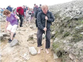  ??  ?? Breen was one of thousands of pilgrims who climbed the mountain in bare feet on so-called ‘Reek Sunday.’