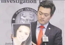  ?? MIKE BELL ?? RCMP Sgt. Frank Jang holds a photo of murder victim Lisa Ellie Marie Baines at RCMP offices in Surrey on Thursday.