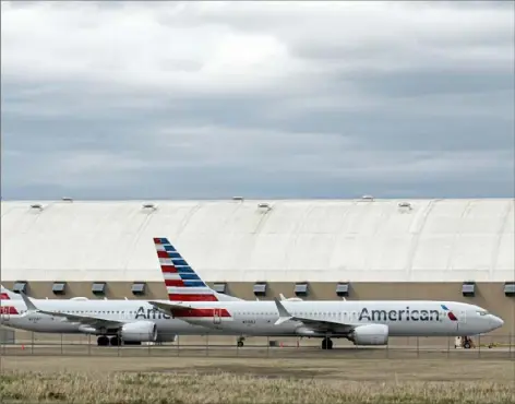  ?? Nick Oxford/The New York Times ?? A pair of Boeing 737 Max 8 aircraft at an American Airlines hangar Saturday at Tulsa Internatio­nal Airport in Oklahoma.