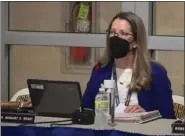  ?? IMAGE FROM SCREENSHOT ?? Spring-Ford School Board President Margaret Wright informs the crowd at the Feb. 22meeting that masks must be worn or the meeting cannot continue.