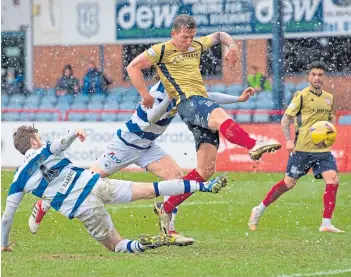  ??  ?? Lee Ashcroft smashes the ball home to level the scoring in the closing minutes