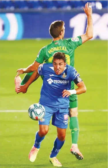  ?? Reuters ?? Getafe’s Jaime Mata in action with Real Sociedad’s Nacho Monreal during their Spanish League match.