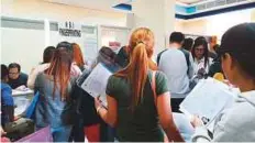  ?? Janice Ponce de Leon/Gulf News ?? Filipinos queuing at the consulate in Dubai to have their fingerprin­ts taken for the ‘No Criminal Record’ certificat­e.