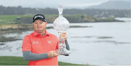  ?? MIKE EHRMANN/GETTY IMAGES ?? Ted Potter Jr. poses with the trophy after winning the AT&T Pebble Beach Pro-Am on Sunday. Dustin Johnson, Jason Day, Phil Mickelson and Chez Reavie finished tied for second. The win is Potter’s first since the Greenbrier Classic in 2012.