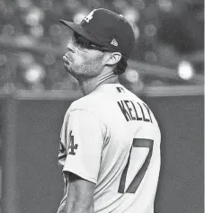  ?? BOB LEVEY/GETTY IMAGES ?? Joe Kelly of the Dodgers reacts after getting Astros batter Carlos Correa out Tuesday.