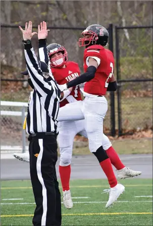  ?? Photos by Ernest A. Brown ?? Tolman’s Alex Medeiros and Leandro DePina, above, celebrate after a touchdown during the Tigers’ 28-7 non-league victory over Middletown Saturday afternoon at Max Read Field.