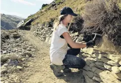  ?? PHOTOS: STEPHEN JAQUIERY ?? Little by little . . . Briar Laurie, of Queenstown, stacks rocks along the Cromwell Gorge cycle trail.