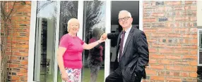  ??  ?? New look Ian Mcpherson of Tom Callaghan Windows with customer Kate McKinnon at her Ayr home